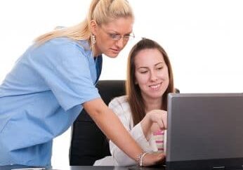 Two female doctors isolate on white background