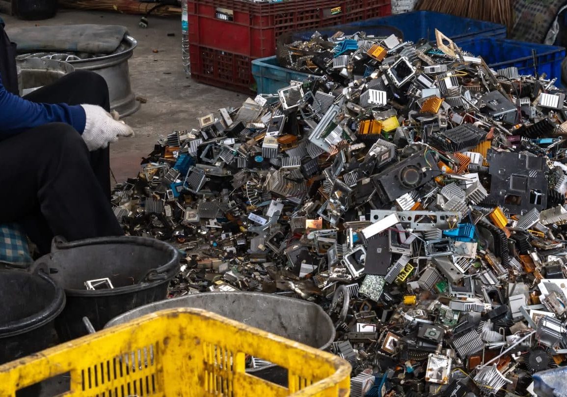 Scrap yard electronic waste for recycling with selective focus. electronic aluminium waste