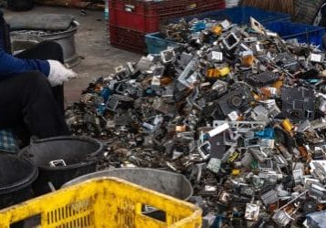 Scrap yard electronic waste for recycling with selective focus. electronic aluminium waste