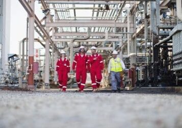 Workers walking at chemical plant