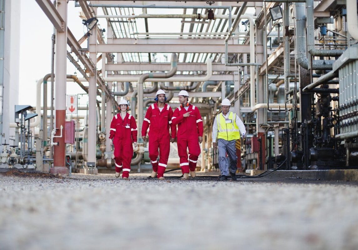 Workers walking at chemical plant